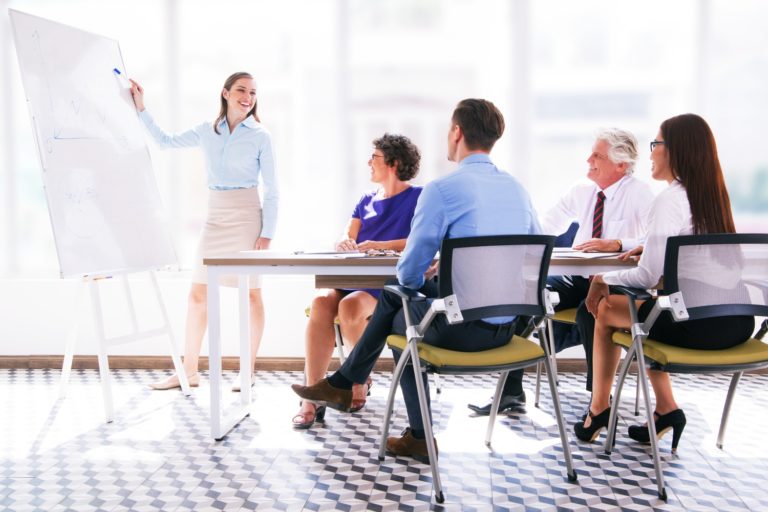 Cheerful business coach explaining strategy