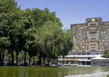 Mexico City, Mexico - March, 19 2006: Central University Campus of the Mexico National Autonomous University, a UNESCO World Heritage Site. The Central Campus constitute a unique and outstanding example of the application of the 20 century modernims style merged with the pre-hispanic Mexican tradition. A one of the most significant icons of modern urbanism and architecture in the country and the region. The image shows the Central Library Building covered with tile works from Juan O'gorman