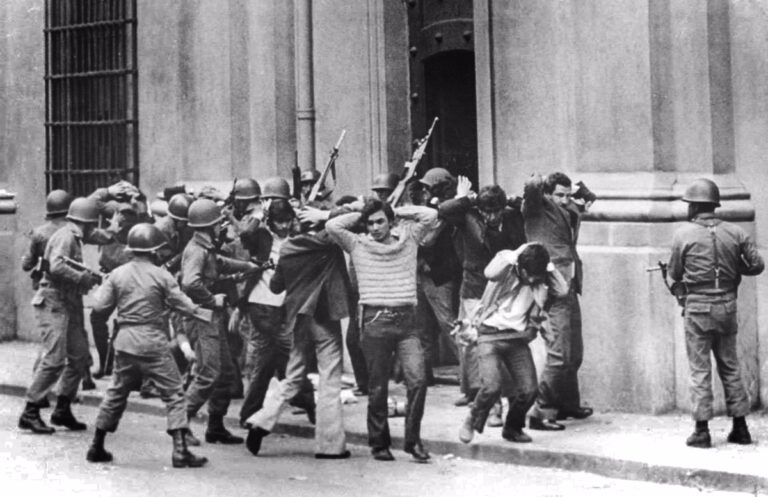 Members of the presidency of former Socialist President Allende being guarded by